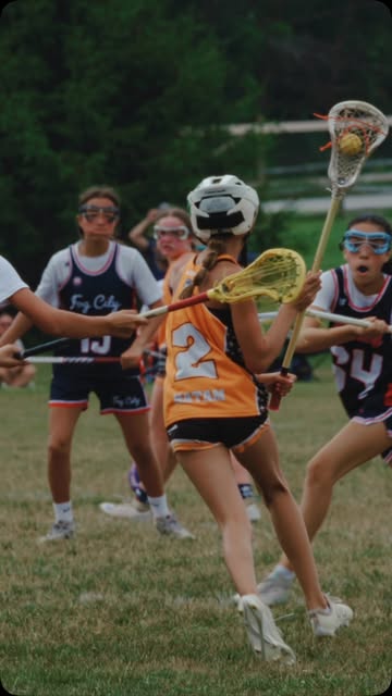 Player #2 driving past two defenders